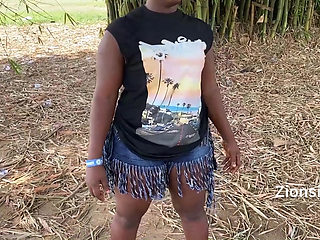 Ebony sexy black girl dances in outdoor with much laughter