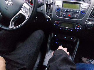 Amateur MILF gives a handjob to a taxi driver and teases him in the car, in public