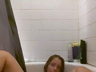 Busty curly brunette with big boobs fucks on couch