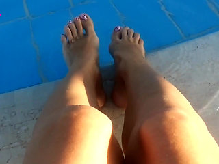 Barefoot Dangling in Swimming Pool Water