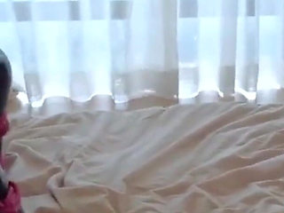 Mz15 - a Puppy Wearing a Latex Suit and Bound by a Red Rope.