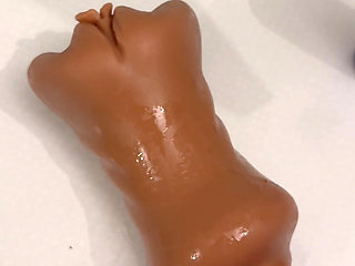 The guy jerks off and cums on his pocket vagina.