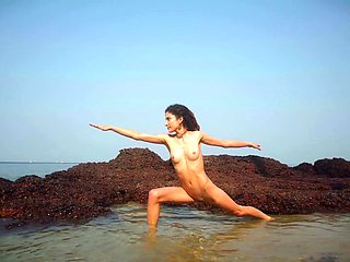 Hot teen stripping seductively and posing naked on the beach