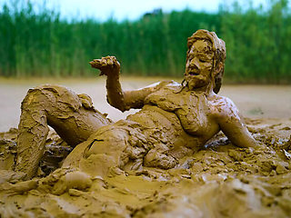 German teen masturbates to orgasm in muddy lake - wet and messy solo fingering