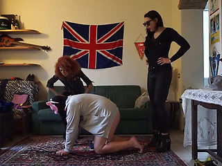 Masked slave gets punished from three femdom chicks