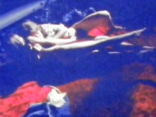 Blue-tinted Vintage Loop Shows Retro Couple in Raw 70s Action