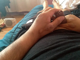 Cute gay man eagerly pulls back his foreskin