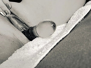 She lets the glass smack