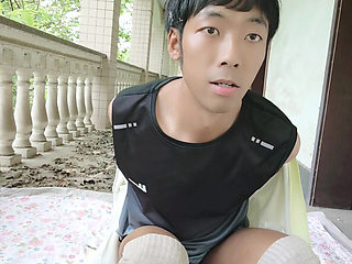 A handsome Asian boy masturbates, moaning, ejaculating, and consuming fluids in an abandoned hotel corridor