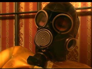Gas mask fetish masturbation dildo penetrated in latex dress