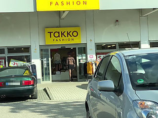 In a super short mini skirt and a thoughtful bodysuit while shopping