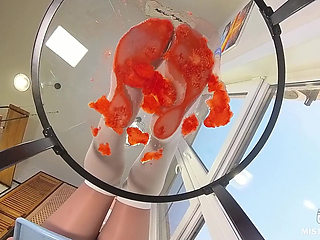 My Nylon Feet Squeezing Strawberry Juice on a Glass Table