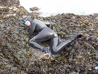 Rubbery Beach Encounter: Lucy's Neoprene Pussy Play with Stranger