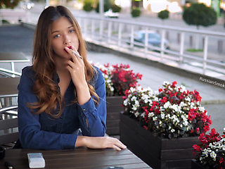 Magnetic Russian Beauty Playing with Cigarette Smoke