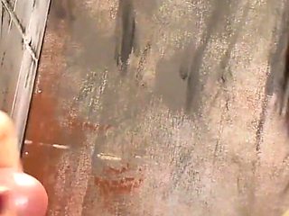 Locked in the bathroom, she can't resist the cock coming out of the wall