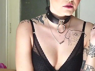 Tattooed gothic lady smoking in the kitchen