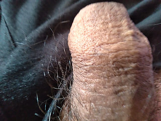 gay man touches his large foreskin for pleasure