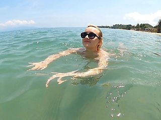 Lovita Fate is a naughty angel in sexy micro bikini on the beach