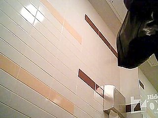 Blonde girl pissing in the toilet on the