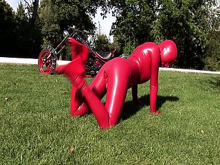 Busty babe toying in full latexwear