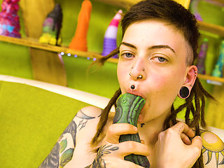 Skinny Inked Girl with Dreadlocks vs. The Toy Wall She's Covered, Everywhere