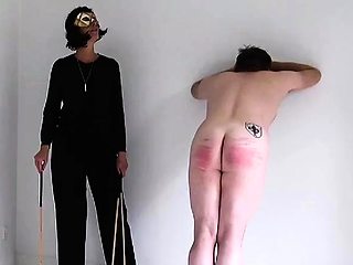 Pitiful slave spanked hard by merciless MILF mistress