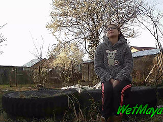 Peeing on some old tires in the yard