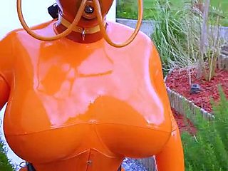 Big breasted amateur MILF freak posing in latex outfit