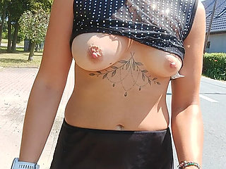 walking down the street in a see-through blouse public flashing of tits and pussy