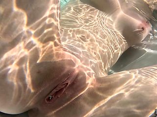 Skinny teen Mary Moon wanking her pussy by the pool in sensual solo action