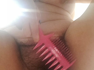 combing the hairy pussy of a milf