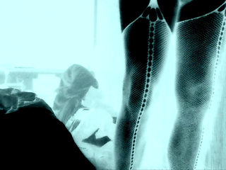 Femboy in fishnet stockings and stripper heels