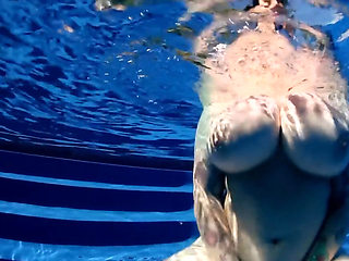BBW babe shows off huge naturals in the pool underwater POV