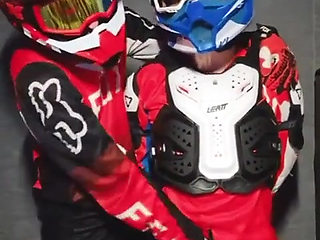 A Guy in a Motocross Gear Gets a Portion on His Mxhelmet