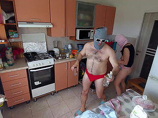 Amateur couple having fun in the kitchen.