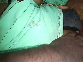 My neighbor's aunt was beautiful in a saree on the bed. I gently rubbed her breasts and shared them on the bed.