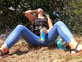 Chubby girl talking on the phone with her boy friend pee in her jeans