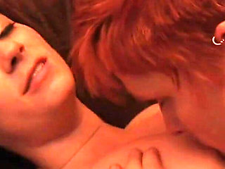 Brunette and red head lesbian sluts enjoy sucking each other's cunts on the sofa