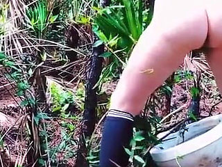 Peeing on a Toilet in the Woods