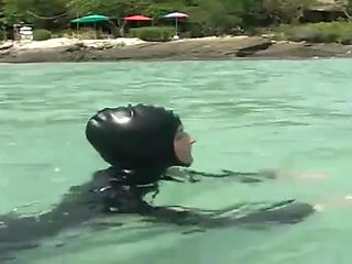Girls in latex on the beach