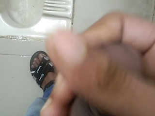I really wanted to have sex, so while urinating, I hit my hand in the office bathroom