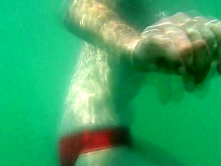 My tits underwater on public beach