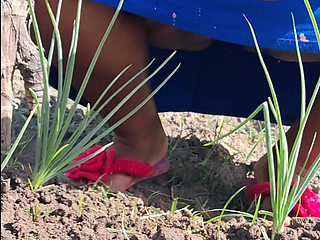 Hot stepmom went to the garden in a dress without panties and neighbor filmed