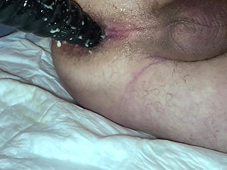 Point of view of grandpa's anal from the side with his black dildo