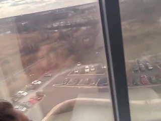 Giving Backshots While Looking Out of 12th Story Hotel