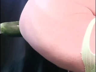 Neon lingerie and a thick cucumber in the ass